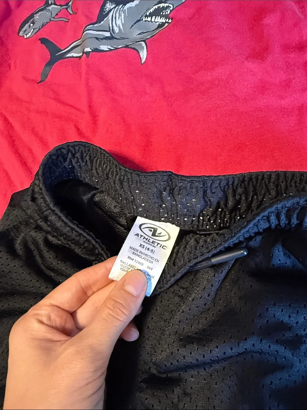 Red Shark Tank Top with Black Athletic Shorts